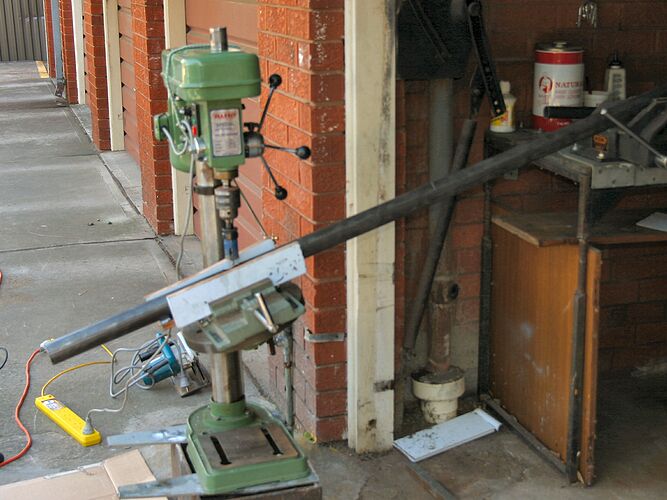 Drill press set up to make headset hole in load bike main tube. Two of these cuts and the holesaw is just about done for... anyone still wonder why large-scale manufacturers prefer aluminium?