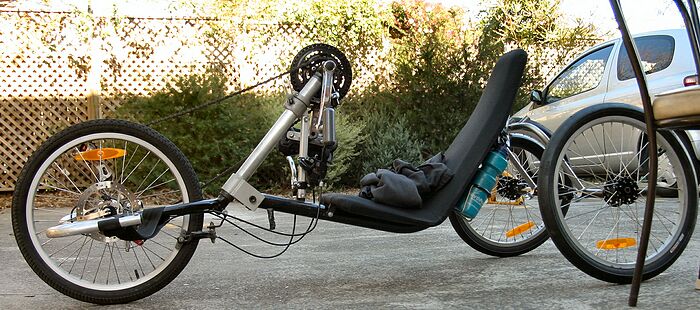 The handcycle. Note the negative trail on the front wheel - a line through the steering axis hits the groud behind the contact patch. This makes the steering very unstable. The front wheel also has very little weight on it, so going up steep or slippery hills might not be possbile.