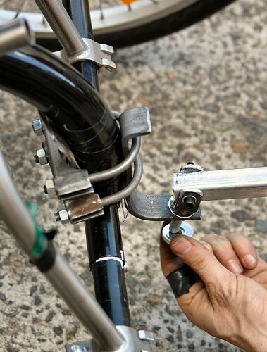 The hitch on the back of the handcycle.