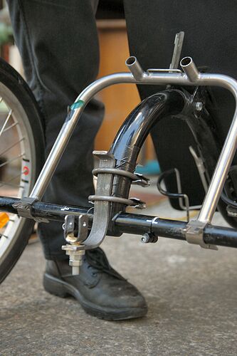 The hitch on the back of the handcycle.