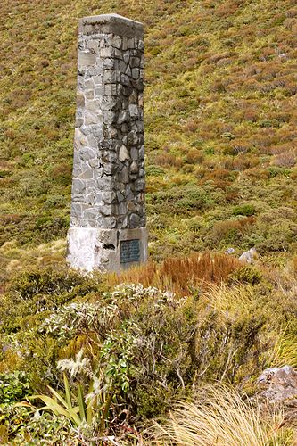 The pillar marking the pass. Note the scrubby vegetation - high rainfall but alpine and windy.