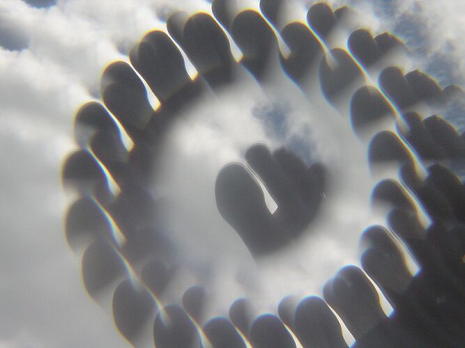 Jan has a silly wee plastic thing with an odd lens inside it. Not actually a kaleidoscope. But photos using the compact digital camera look cool. The small front element means the compact only shows the view thru the lens, where the DSLR shows half the device.