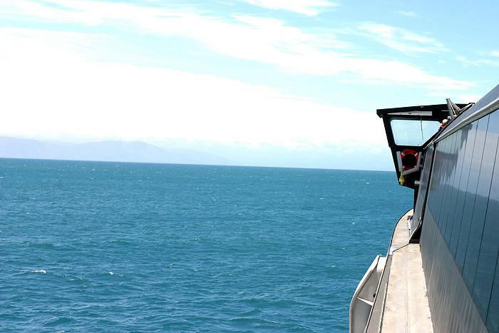 Ferry trip from Picton to Wellington through the Marlborough Sounds and Cook Strait. Looking towards the North Island from the entrance to Tory Channel.